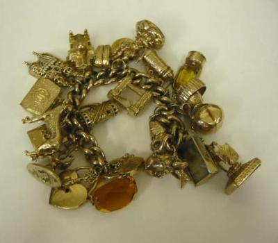 Appraisal: A CT GOLD CHARM BRACELET the curb links hanging with