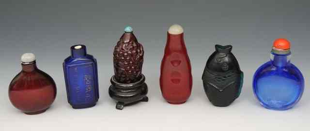 Appraisal: A CHINESE BEIJING GREEN GLASS SNUFF BOTTLE modelled as a