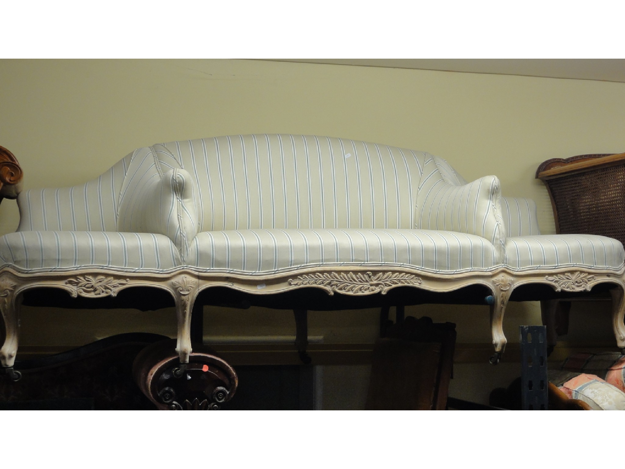 Appraisal: An unusual three to four seat conversation type sofa with