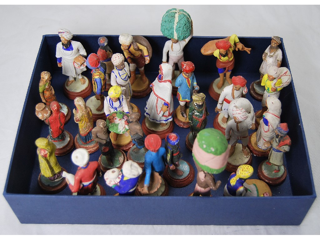 Appraisal: A collection of twenty-nine painted terracotta figures of Indian street