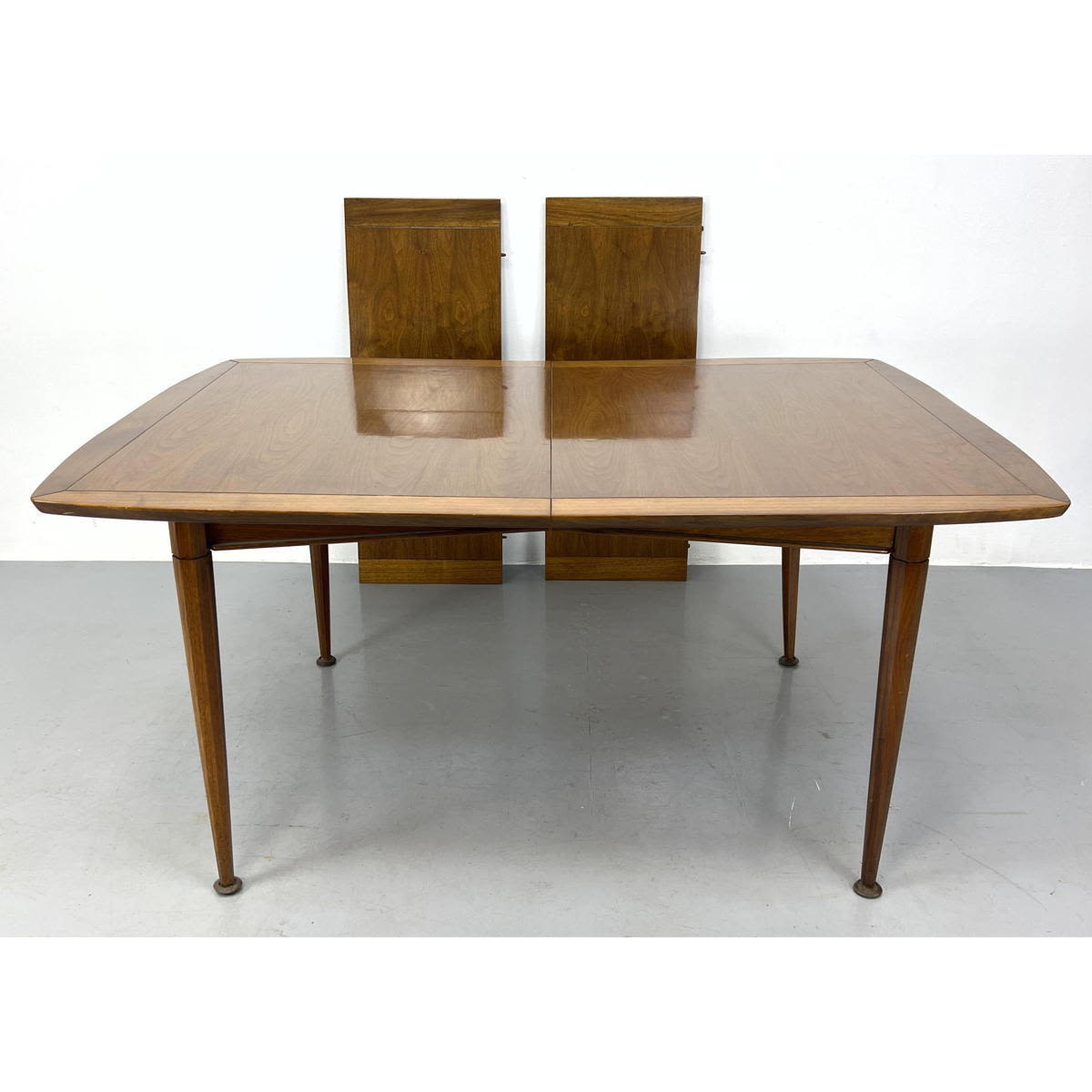 Appraisal: American Modern Walnut Dining table Banded Edges Drumstick Legs Includes