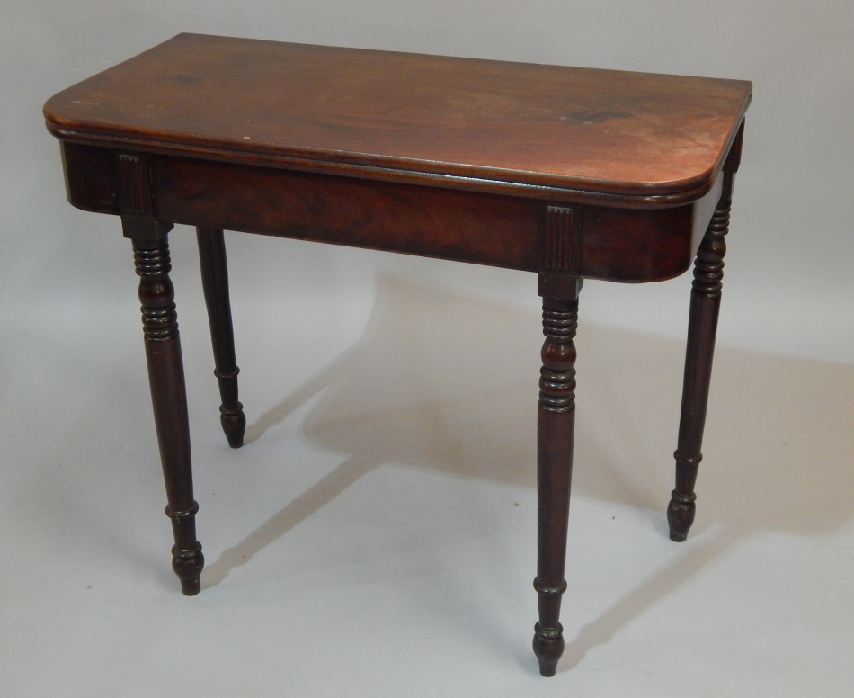 Appraisal: An early thC mahogany tea table the rectangular top with