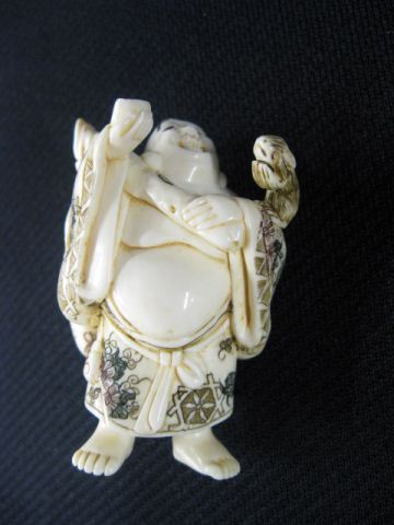 Appraisal: Carved Ivory Netsuke of Hotei with treasure bag on his