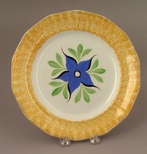 Appraisal: Yellow spatter plate th c with morning glory dia