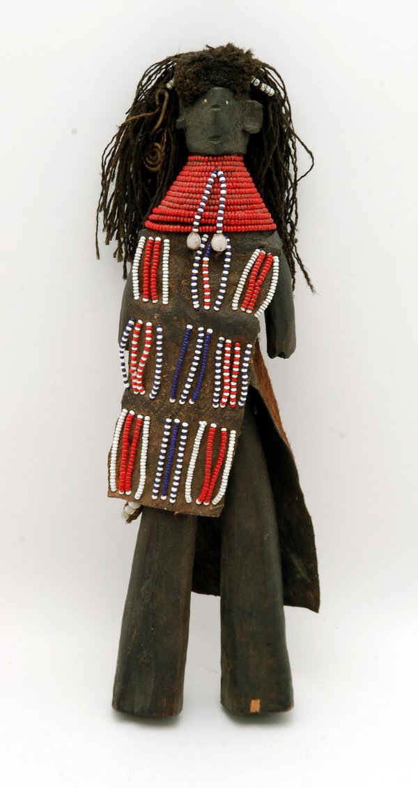 Appraisal: African doll Wood with hide clothing decorated with glass beads