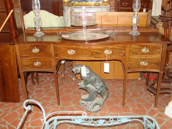 Appraisal: George III mahogany serpentine sideboard th century shaped top with