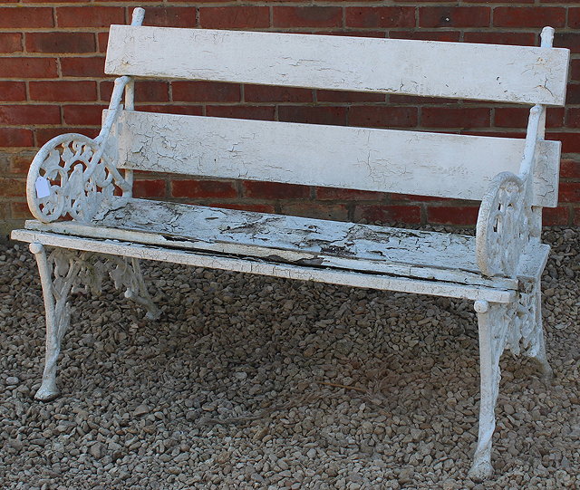 Appraisal: A VICTORIAN WHITE PAINTED GARDEN SEAT with cast iron ends