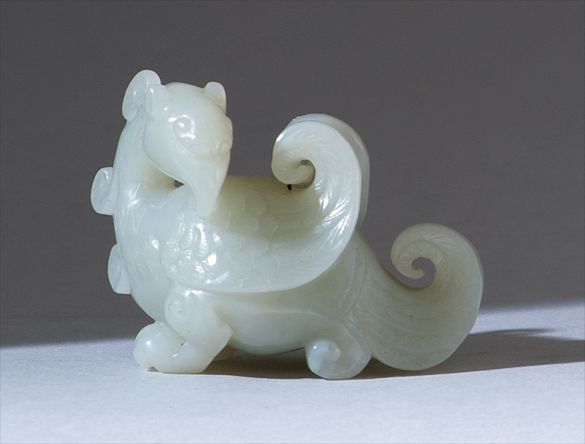 Appraisal: WHITE JADE CARVING Circa In phoenix form Length cm ConditionUndamaged