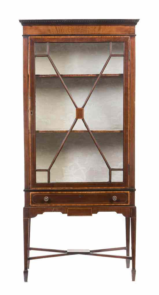 Appraisal: A Georgian Style Vitrine Cabinet having a dentiled cornice and