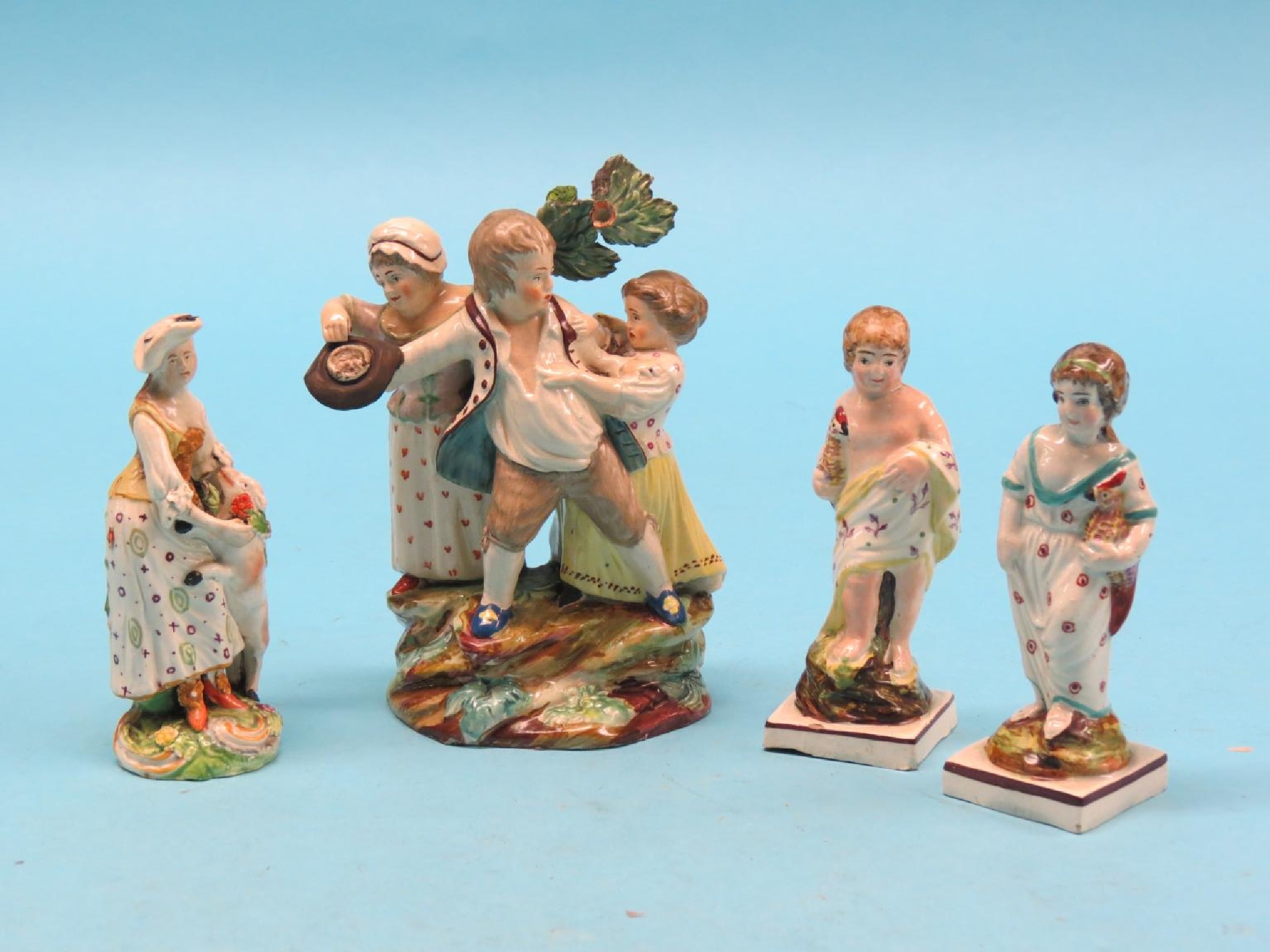 Appraisal: Early Staffordshire pottery comical figure group a pair of figures