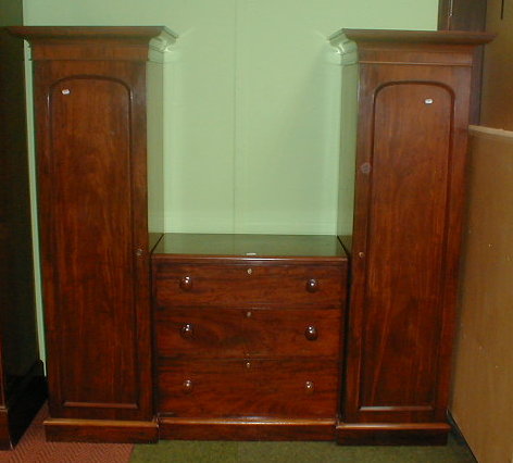 Appraisal: A Victorian mahogany combination wardrobe with single doors flanking a