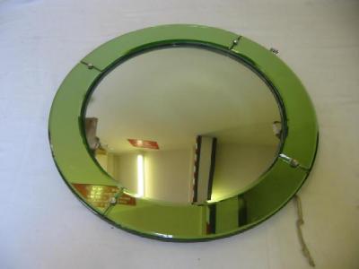 Appraisal: AN ART DECO WALL MIRROR of circular form the convex