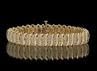 Appraisal: A Ladies' Diamond Bracelet k yellow gold articulated design bracelet