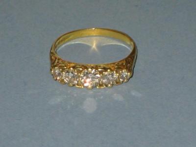 Appraisal: AN EDWARDIAN FIVE STONE DIAMOND RING the graduated stones set