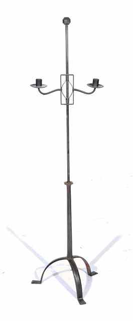 Appraisal: Ernest Gimson British - A steel floor-standing twin-light candle stand