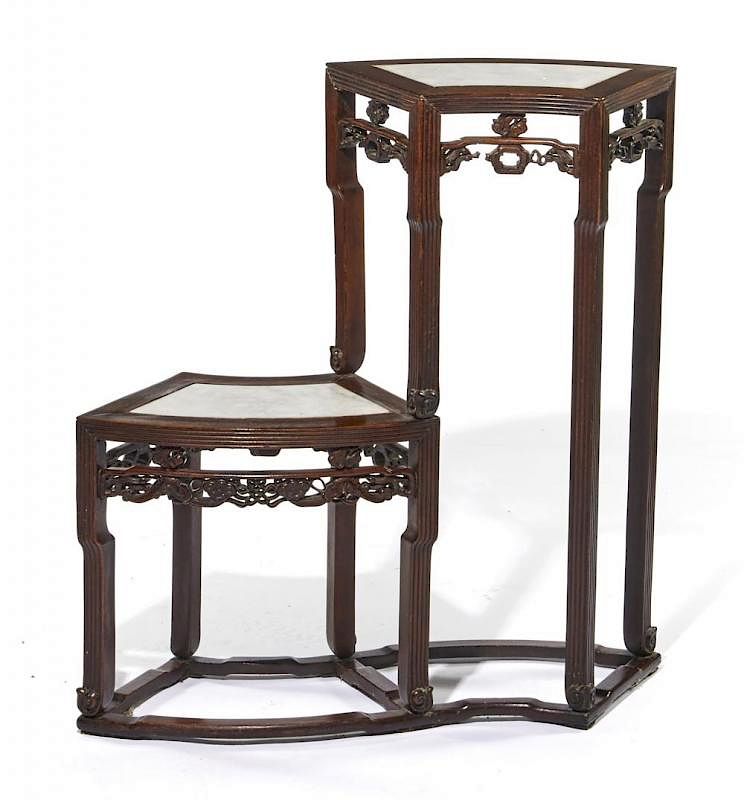 Appraisal: Chinese two tier carved wood stand with marble tops Chinese