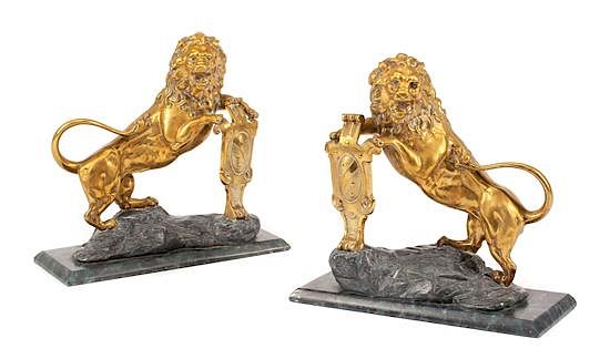 Appraisal: A Pair of English Gilt Bronze Lion Ornaments Width of