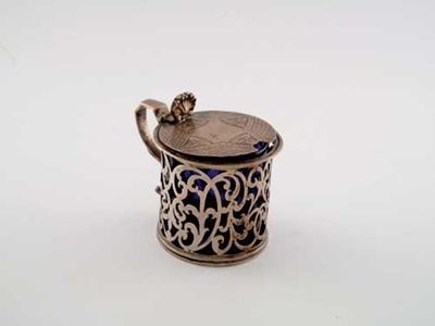 Appraisal: A Victorian pierced mustard pot with a blue glass liner