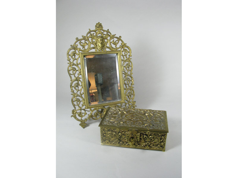 Appraisal: Ornate Brass Dresser Box Dressing Mirror the mirror with female