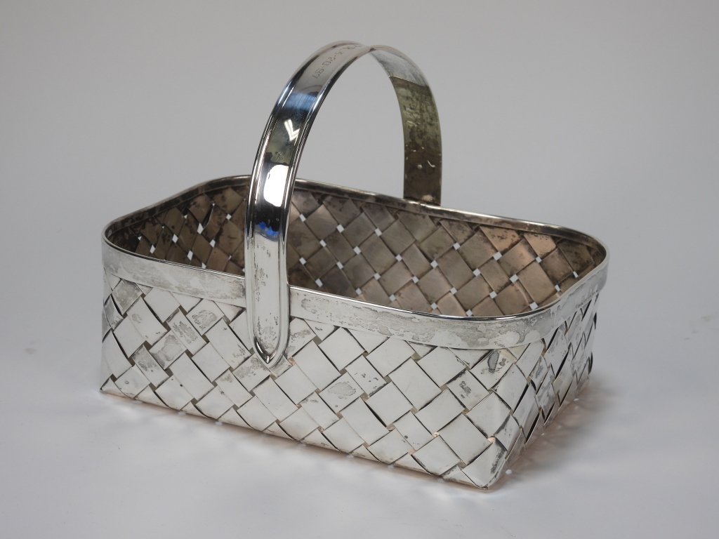 Appraisal: CARTIER STERLING SILVER BASKET FranceCirca Rectangular basket with woven sterling