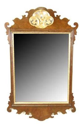 Appraisal: A George II walnut and parcel gilt fret-frame mirror the