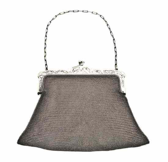 Appraisal: An American Silver Plate Mesh Purse the frame decorated with