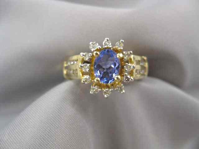 Appraisal: Tanzanite Diamond Ring rich carat oval gem and diamonds totaling