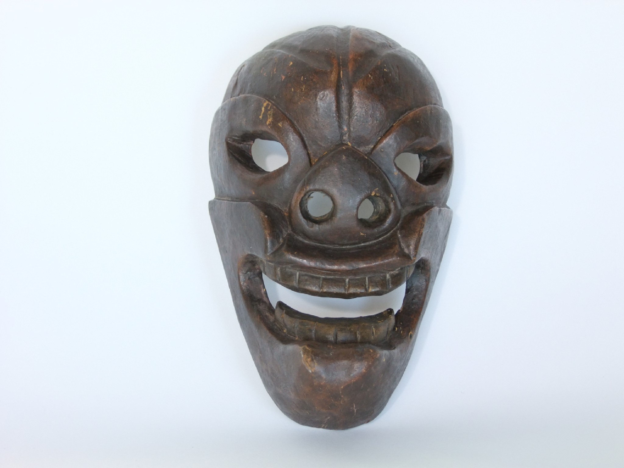 Appraisal: A small oriental carved timber facial mask with pierced detail