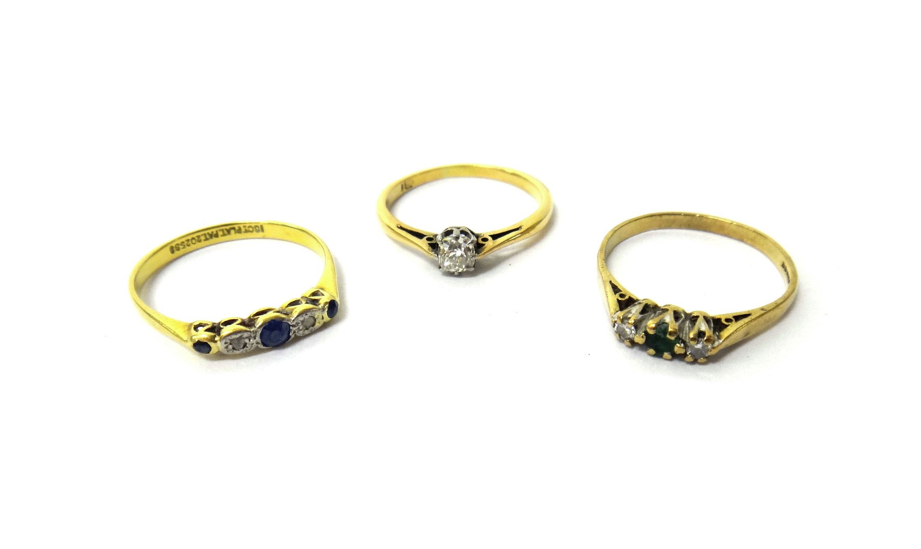 Appraisal: A gold ring claw set with a cushion shaped diamond