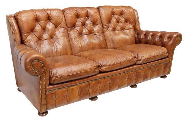 Appraisal: Italian three-seat leather sofa th c with button-tufted back apron