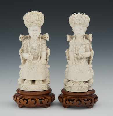 Appraisal: Carved Ivory Figurines of an Emperor and an Empress Two