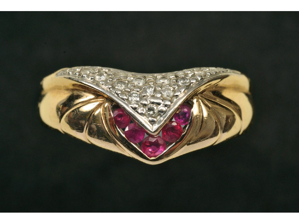 Appraisal: A Ruby and Diamond Wishbone Ring the front millegrain-set brilliant-cut