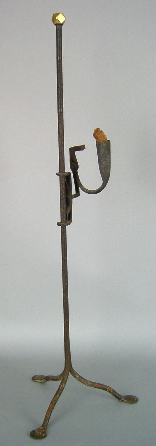 Appraisal: Wrought iron rush light late th c with brass finial