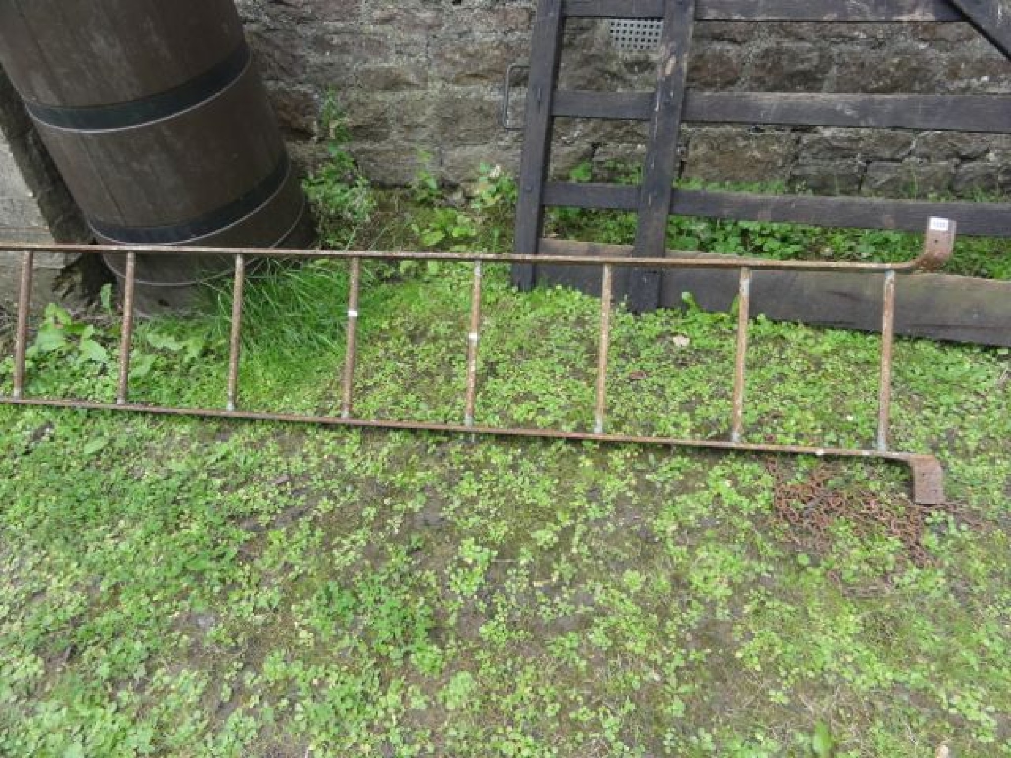 Appraisal: A cast iron ten rung ladder farm industrial related