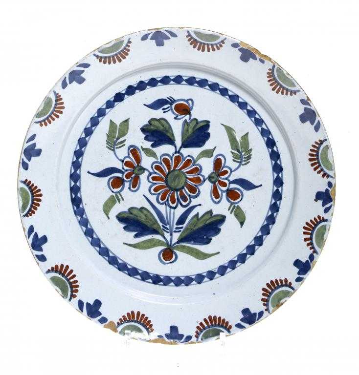 Appraisal: A BRISTOL DELFTWARE DISH painted in blue red and green