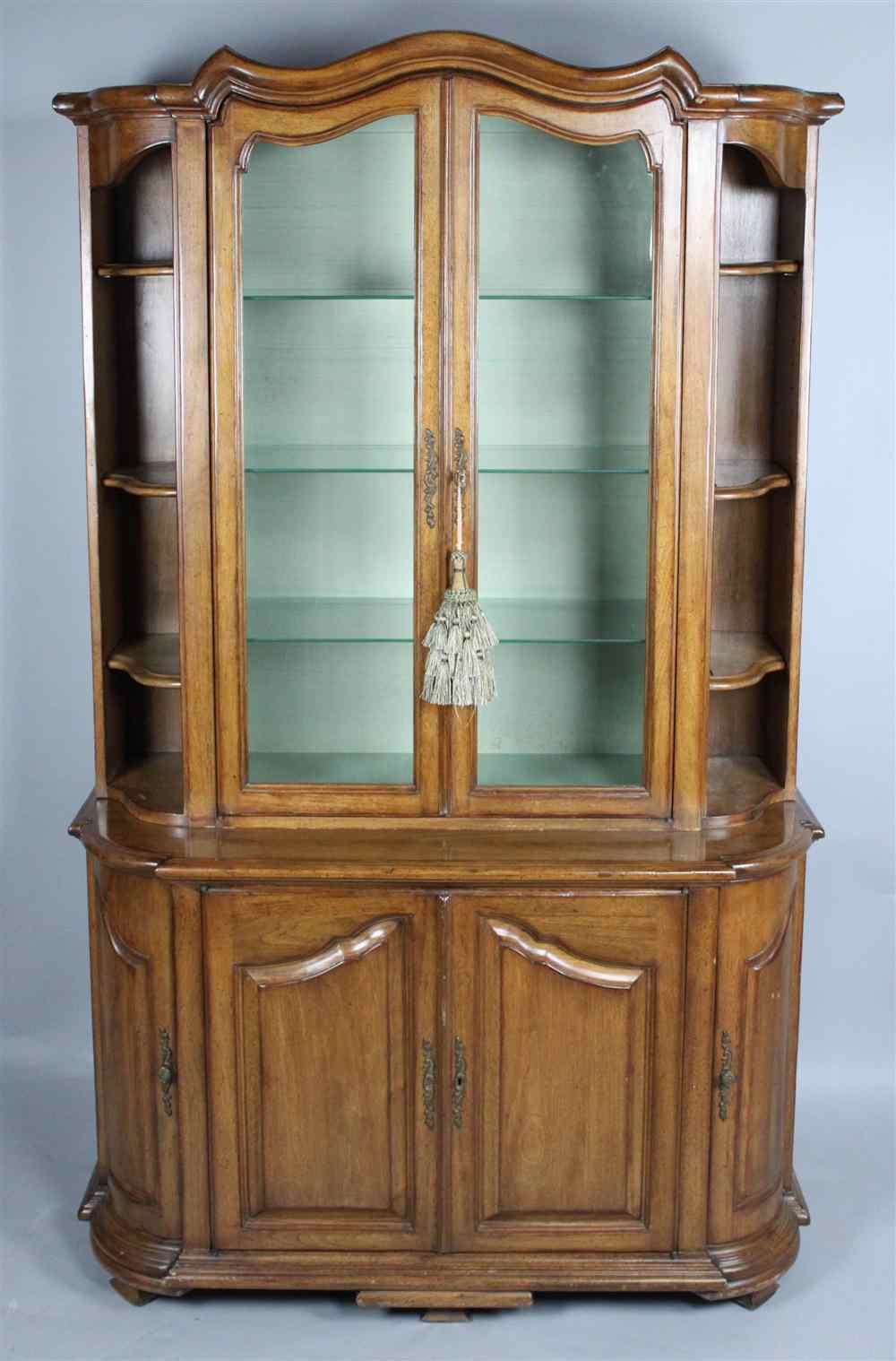 Appraisal: FRENCH PROVINCIAL STYLE WALNUT WALL CABINET in two pieces with