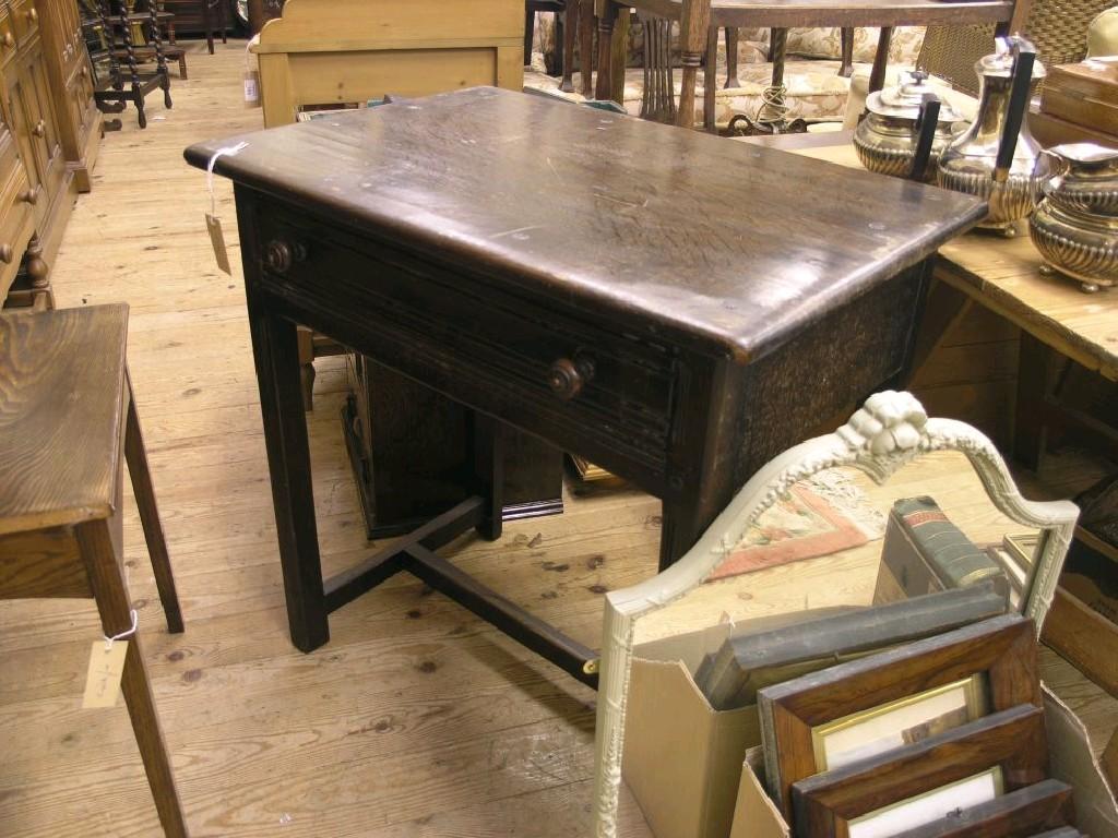 Appraisal: An oak side table with single frieze drawer on moulded