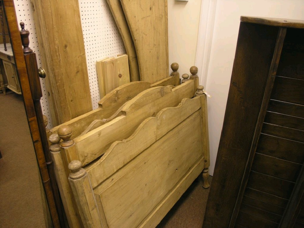 Appraisal: A pair of late th century stripped pine nursery bedsteads