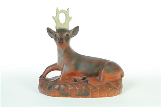 Appraisal: LARGE CHALKWARE DEER American st half- th century Reclining deer