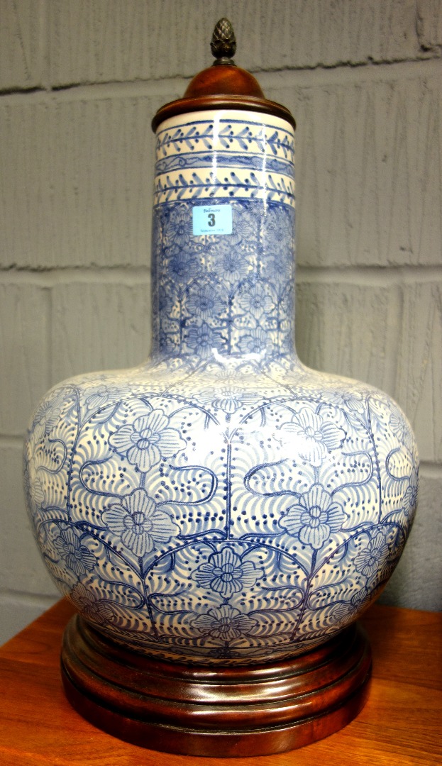 Appraisal: A modern blue and white bulbous porcelain vase with wooden