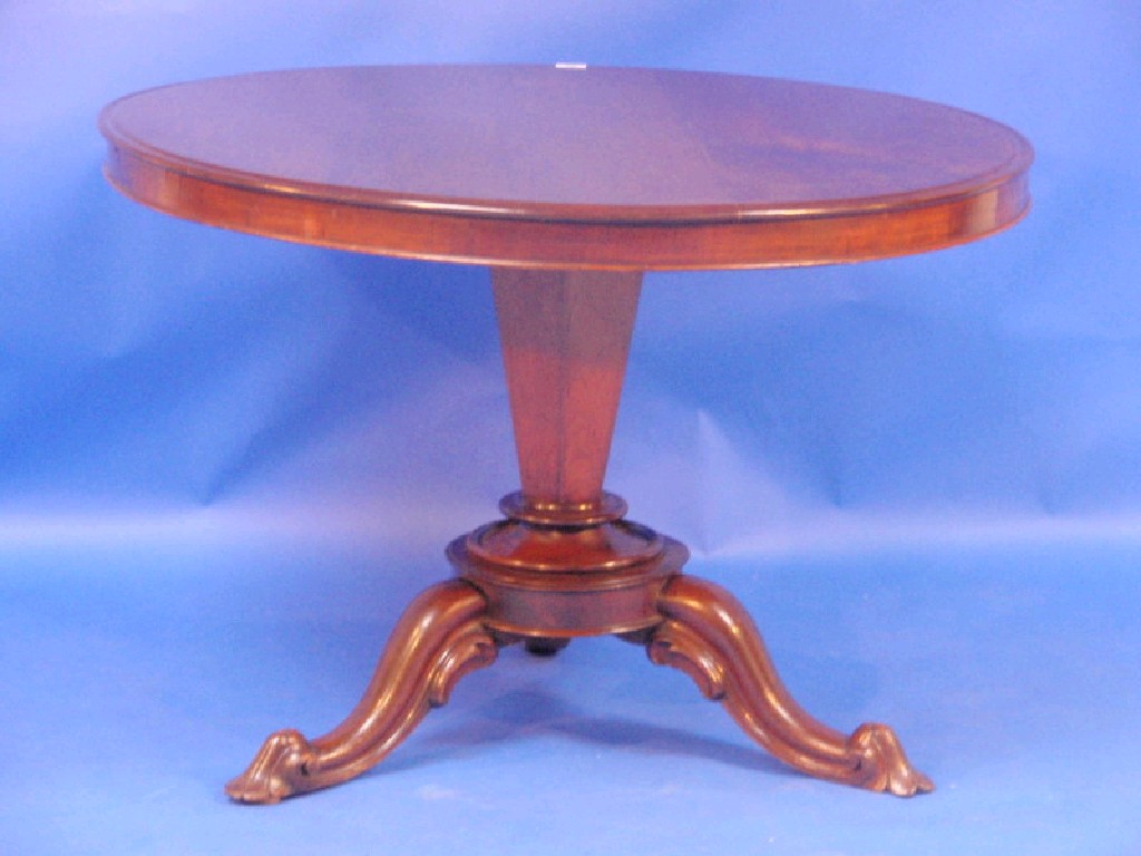 Appraisal: A Victorian mahogany breakfast table with circular tilt top taper