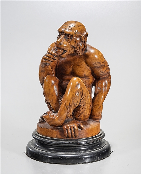 Appraisal: Wood sculpture of a monkey-like figure seated and eating no