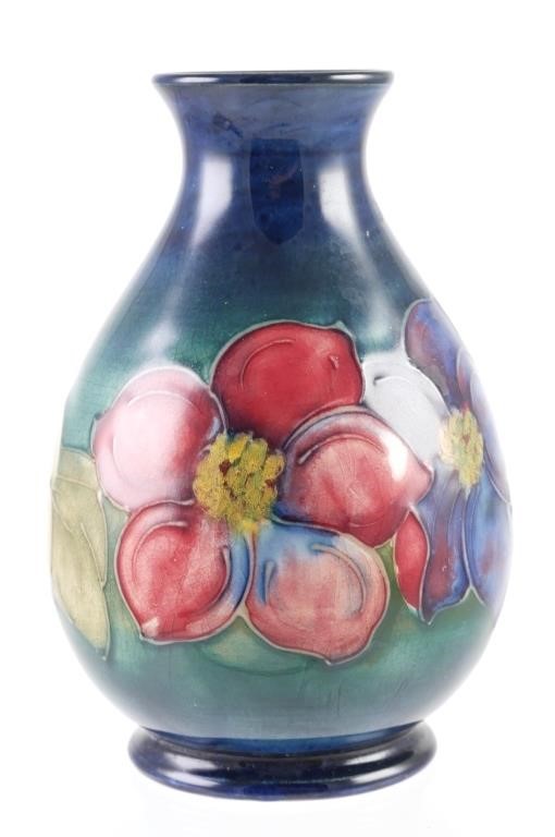 Appraisal: Hand painted floral themed vase impressed Moorcroft mark under base