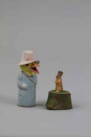 Appraisal: QUACKING DUCK AND RABBIT ON STUMP CANDY CONTAINERS Germany composition