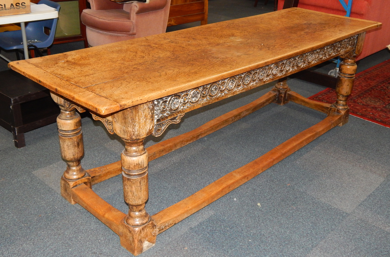 Appraisal: A thC style oak refectory table the two plank top