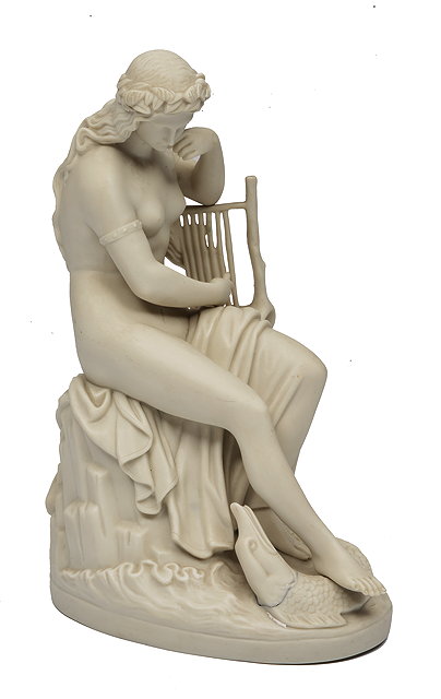 Appraisal: A COPELAND PARIAN WARE FIGURINE OF A GIRL sitting on