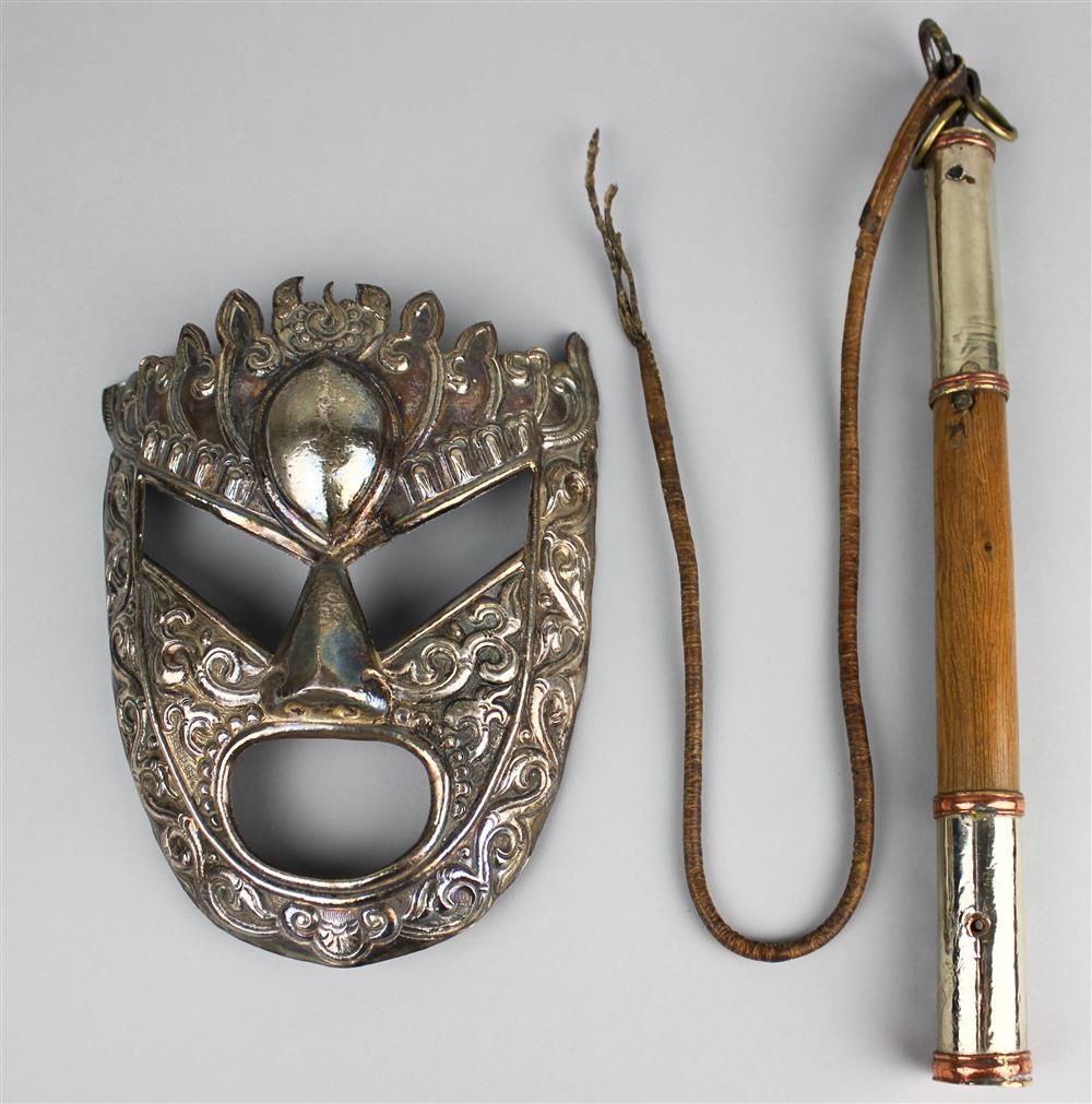 Appraisal: SINO-TIBETAN SILVERED FLAME MOTIF MASK AND A MONGOLIAN WHIP the