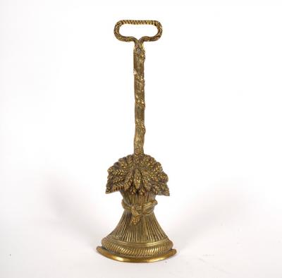 Appraisal: A brass door porter in the form of a wheat