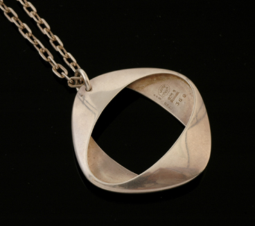 Appraisal: A silver pendant and chain by Georg Jensen The sterling