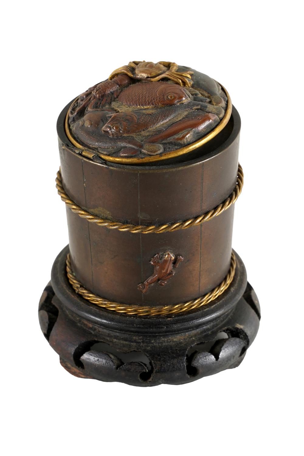 Appraisal: JAPANESE BRONZE INKWELLthe hinged lid decorated with shellfish with wooden